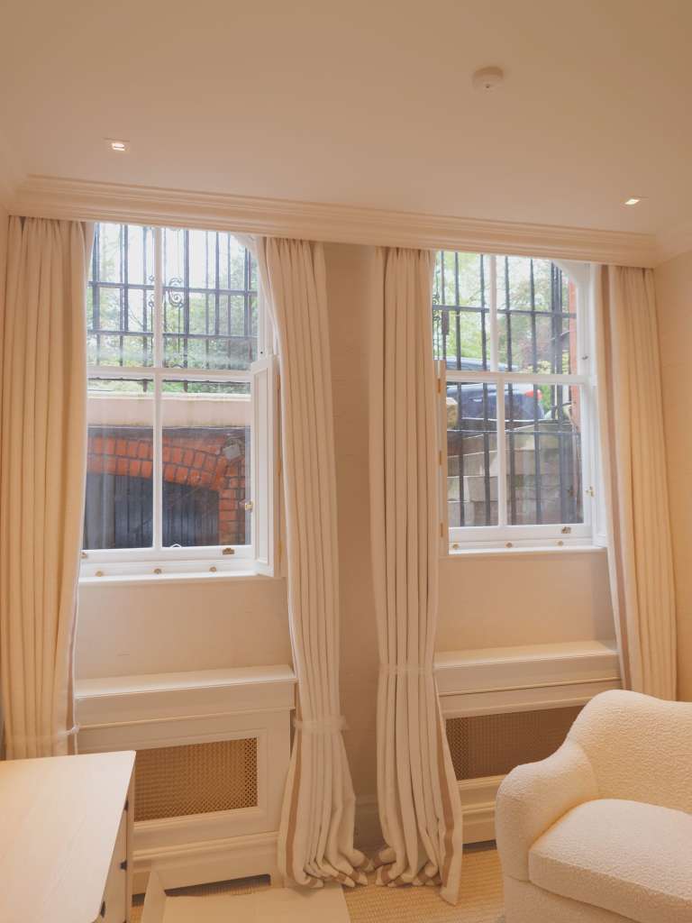 Interior view of a newly replaced traditional wooden box sash window in a London period property